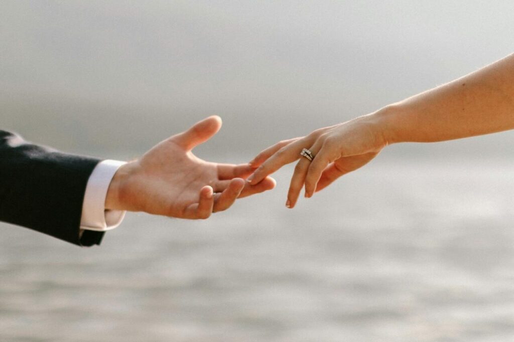 Wedding Band Ring Germany - Where to Go Ring Shopping 4 woman reaching for man